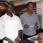 Al (right) and Babu ice a freshly baked batch of mini cupcakes.